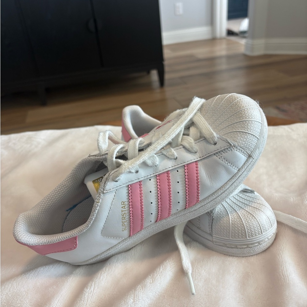 Adidas superstar tennis shoes.